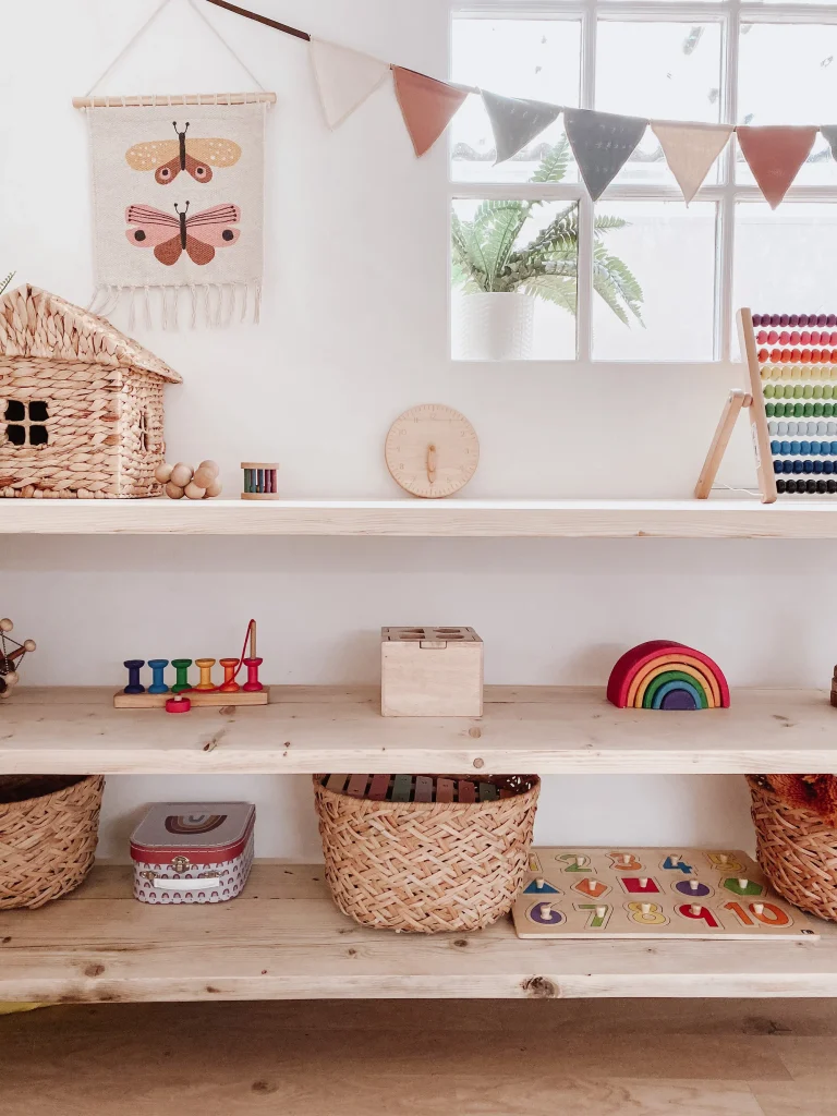 Start Montessori at home with open shelves, simple wooden toys, and child-accessible learning materials
